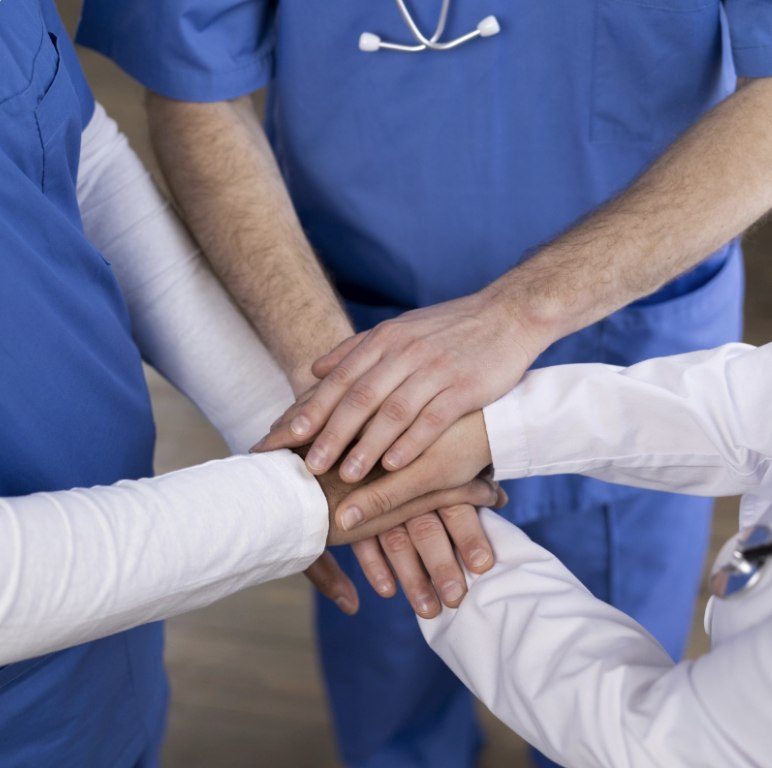 medical practitioners holding hands