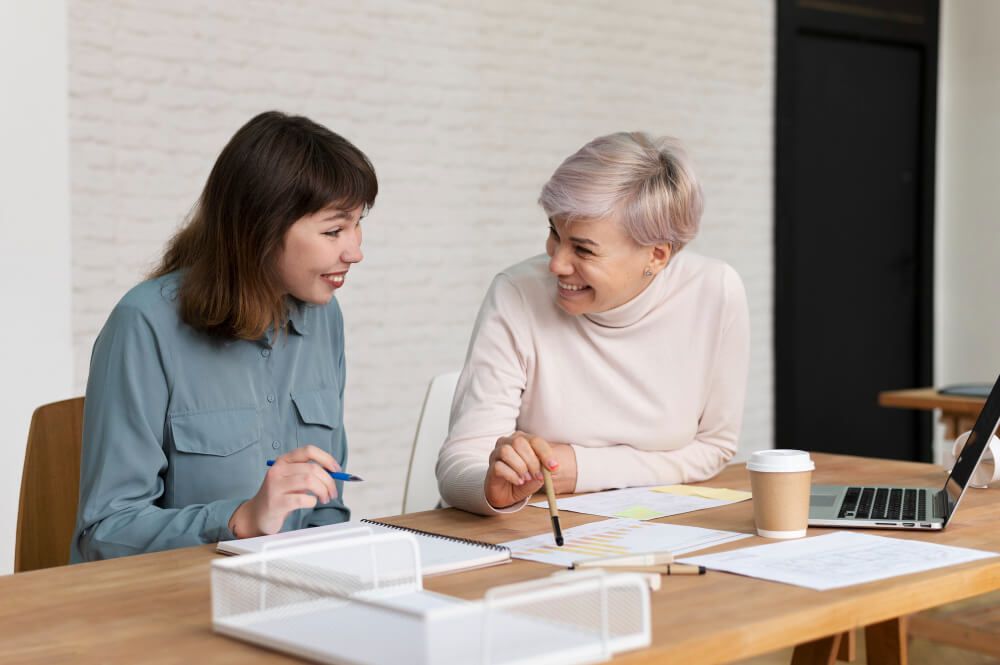 two ladies working together as a team