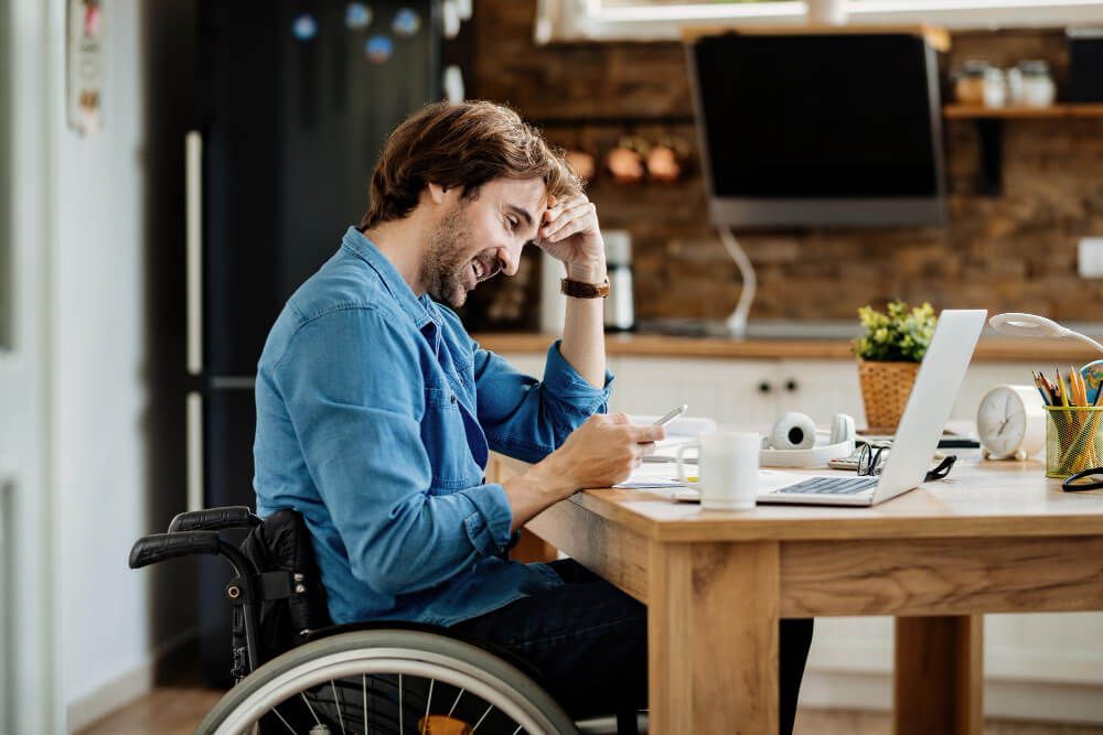 man in wheelchair working